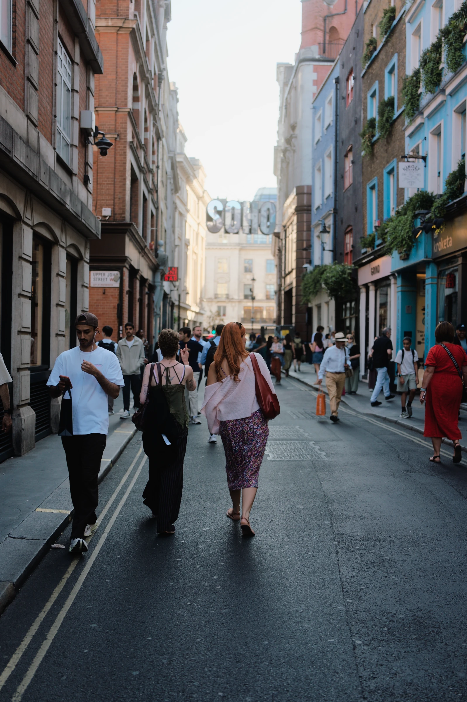 Pedestrians in a wider street scene