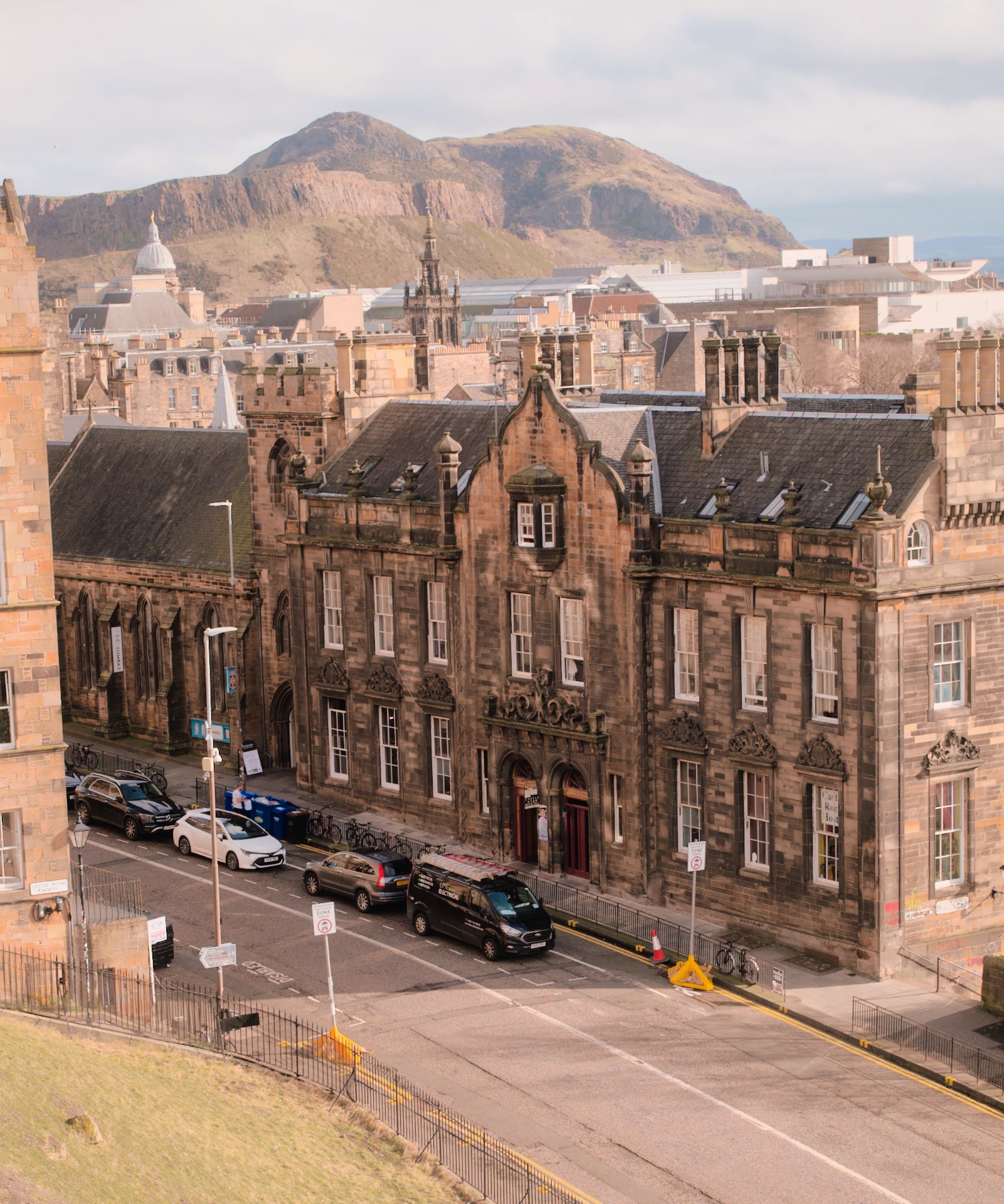 Sunlit Edinburgh stonework beneath the distant hill, developed from a Sigma BF RAW with a tighter foreground crop